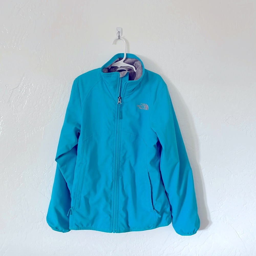 The North Face blue girl winter jacket, size: 10-12. Great condition.